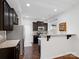 Galley kitchen with dark cabinets, granite counters at 2565 Meadow Crossing Dr, Dallas, NC 28034