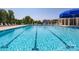 Community lap pool with a blue umbrella at 3721 Cullen Meadows Dr, Davidson, NC 28036