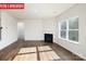 Living room with fireplace, hardwood floors, and access to bathroom at 3721 Cullen Meadows Dr, Davidson, NC 28036