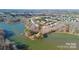 An aerial view of townhomes surrounded by water and lush greenery at 4146 La Crema Dr, Charlotte, NC 28214