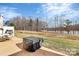Large backyard near lake featuring an outdoor table and grill perfect for entertaining friends and Gathering at 4146 La Crema Dr, Charlotte, NC 28214
