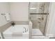 Modern bathroom with a separate tub and shower with tiled surround and glass door at 4146 La Crema Dr, Charlotte, NC 28214