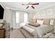 Comfortable main bedroom with a ceiling fan and calming decor at 4146 La Crema Dr, Charlotte, NC 28214