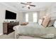 Relaxing main bedroom featuring a large dresser and neutral color palette at 4146 La Crema Dr, Charlotte, NC 28214