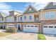 Charming townhomes feature attached garages and manicured landscaping at 4146 La Crema Dr, Charlotte, NC 28214