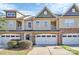 Charming townhomes with attached garages and well-maintained landscaping at 4146 La Crema Dr, Charlotte, NC 28214