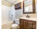 Clean bathroom with shower/tub combo, vanity, and tile flooring at 549 Spring Sw St, Concord, NC 28025