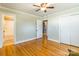 Bedroom with hardwood floors, access to bathroom, and spacious closets at 549 Spring Sw St, Concord, NC 28025