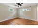 Cozy bedroom with hardwood floors, ceiling fan, and natural light at 549 Spring Sw St, Concord, NC 28025