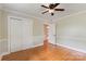 Bedroom featuring hardwood floors, closet, neutral walls and a ceiling fan at 549 Spring Sw St, Concord, NC 28025