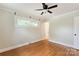 Comfortable bedroom with hardwood floors and a ceiling fan at 549 Spring Sw St, Concord, NC 28025