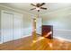 Bedroom with hardwood floors, double closets, and natural light at 549 Spring Sw St, Concord, NC 28025