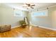 Bright bedroom with hardwood floors, ceiling fan, and large windows at 549 Spring Sw St, Concord, NC 28025