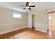 Neutral bedroom featuring hardwood floors, closet, a ceiling fan, and natural light at 549 Spring Sw St, Concord, NC 28025
