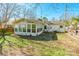 Back exterior view showing sunroom addition at 549 Spring Sw St, Concord, NC 28025