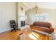 Living room boasts hardwood floors, fireplace, and large windows at 549 Spring Sw St, Concord, NC 28025