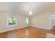 Bright and spacious living room with hardwood floors and a decorative chandelier at 549 Spring Sw St, Concord, NC 28025