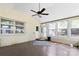 Bright sunroom with lots of natural light, multiple windows, ceiling fan and access to the backyard at 549 Spring Sw St, Concord, NC 28025