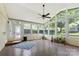 Bright sunroom with lots of natural light, multiple windows, ceiling fan and access to the backyard at 549 Spring Sw St, Concord, NC 28025