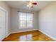 Comfortable bedroom with a large window and hardwood flooring at 8046 Lucky Creek Ln, Denver, NC 28037