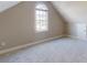 Neutral bedroom features a vaulted ceiling and a large window for natural light at 8046 Lucky Creek Ln, Denver, NC 28037