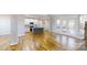 Open-concept living room showcasing beautiful hardwood floors and natural light at 8046 Lucky Creek Ln, Denver, NC 28037