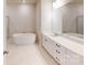 Spa-like bathroom with a large soaking tub and double vanity at 9601 Pointer Rd # 77, Huntersville, NC 28078