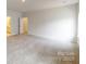 Large bedroom with plush carpeting and access to a bathroom at 9601 Pointer Rd # 77, Huntersville, NC 28078