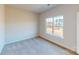 Well-lit bedroom with carpet and a window offering a neighborhood view at 9601 Pointer Rd # 77, Huntersville, NC 28078