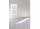 Bright bedroom with plush carpet and natural light from a window at 9605 Pointer Rd # 78, Huntersville, NC 28078