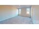 This bedroom features two windows providing natural light and carpeted flooring at 9605 Pointer Rd # 78, Huntersville, NC 28078