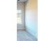 This bedroom features a window providing natural light and carpeted flooring at 9605 Pointer Rd # 78, Huntersville, NC 28078
