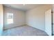 This bedroom features a window providing natural light and a standard closet at 9605 Pointer Rd # 78, Huntersville, NC 28078