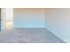 Spacious bedroom with neutral carpet and natural light; door open to the adjacent room at 9605 Pointer Rd # 78, Huntersville, NC 28078