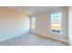 Well-lit bedroom with plush carpeting and two windows at 9605 Pointer Rd # 78, Huntersville, NC 28078