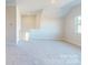 Large bonus room with plush carpeting and a bright window at 9605 Pointer Rd # 78, Huntersville, NC 28078