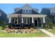 Charming home with a covered front porch, stone accents, and beautiful landscaping at 9605 Pointer Rd # 78, Huntersville, NC 28078