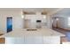 Kitchen with a large island, white cabinetry, a microwave, and modern finishes at 9605 Pointer Rd # 78, Huntersville, NC 28078