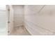 Large walk-in closet with wire shelving and a door to the bathroom at 9605 Pointer Rd # 78, Huntersville, NC 28078