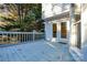 Back deck with a light blue painted floor and a view of the trees at 9709 Calpher Ct, Matthews, NC 28105