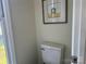 Half-bath with a modern toilet and neutral wall paint at 9709 Calpher Ct, Matthews, NC 28105