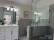 Modern bathroom featuring glass shower and updated vanity at 9709 Calpher Ct, Matthews, NC 28105