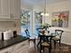 Cozy eat-in kitchen nook with a breakfast table, seating for four, and natural light at 9709 Calpher Ct, Matthews, NC 28105