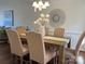 Stylish dining room with seating for six, a modern chandelier, and elegant decor at 9709 Calpher Ct, Matthews, NC 28105