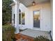 Close up of the home's front porch with a brick walkway and manicured landscaping at 9709 Calpher Ct, Matthews, NC 28105