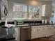 Well-lit kitchen featuring granite countertops, stainless steel appliances, and lots of natural light at 9709 Calpher Ct, Matthews, NC 28105