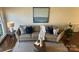 Comfortable living room with a sofa, stylish pillows, and decorative accents at 9709 Calpher Ct, Matthews, NC 28105