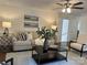 Open living space with doors to the outside, fireplace, and comfortable seating at 9709 Calpher Ct, Matthews, NC 28105