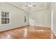 Spacious bedroom featuring hardwood floors, high ceilings, and large windows at 10302 Sawtimber Ct, Huntersville, NC 28078