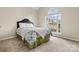 Cozy bedroom with a large window allowing natural light at 10302 Sawtimber Ct, Huntersville, NC 28078